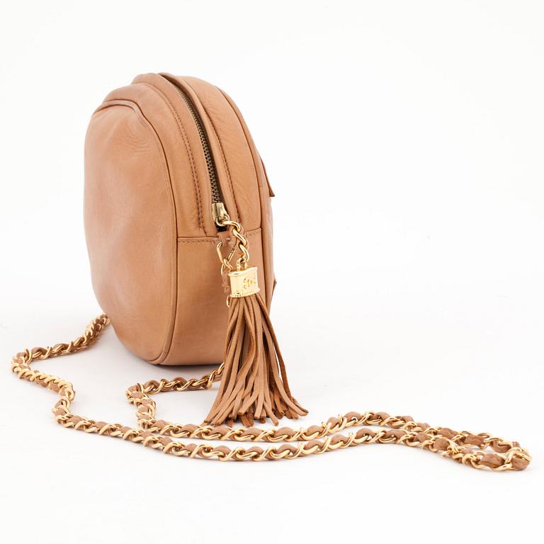 CHANEL, a beigebrown leather shoulder bag.