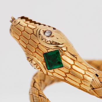 A flexible bracelet. An emerald and rose-cut diamonds on snake head.