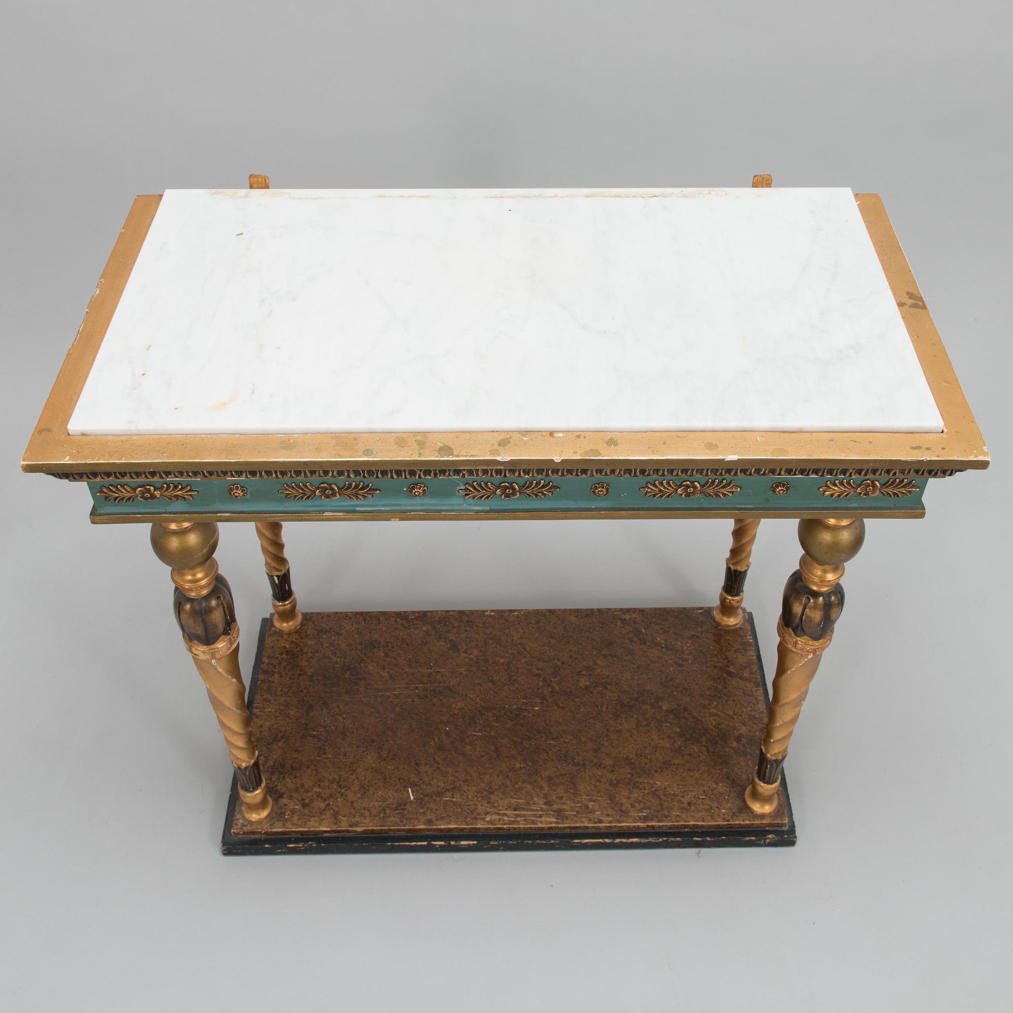 An early 20th century mirror with console table in late Gustavian style.