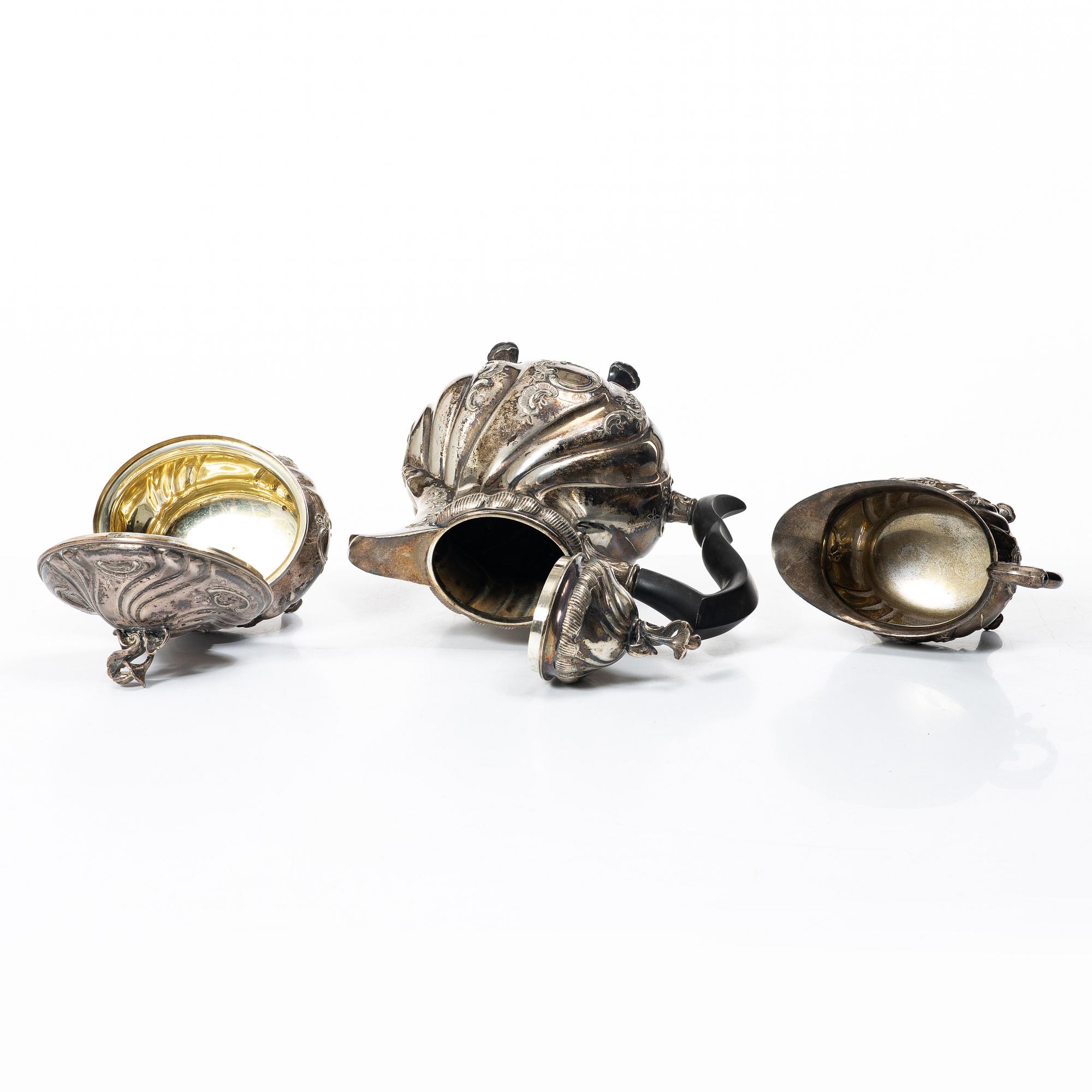 C.G. Hallberg, A three piece Roccoco style silver coffee service, Stockholm 1946.