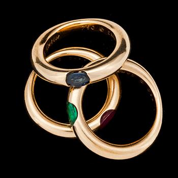 Cartier gold rings with ruby, emerald and blue sapphire.