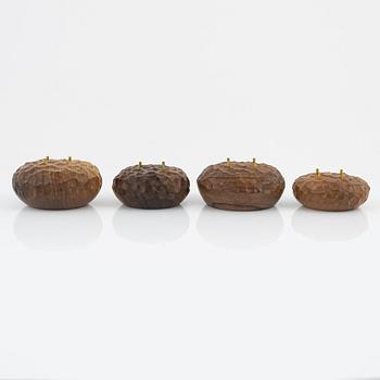 Magnus Ek, a set of four walnut wood canapé holders for Oaxen Krog.