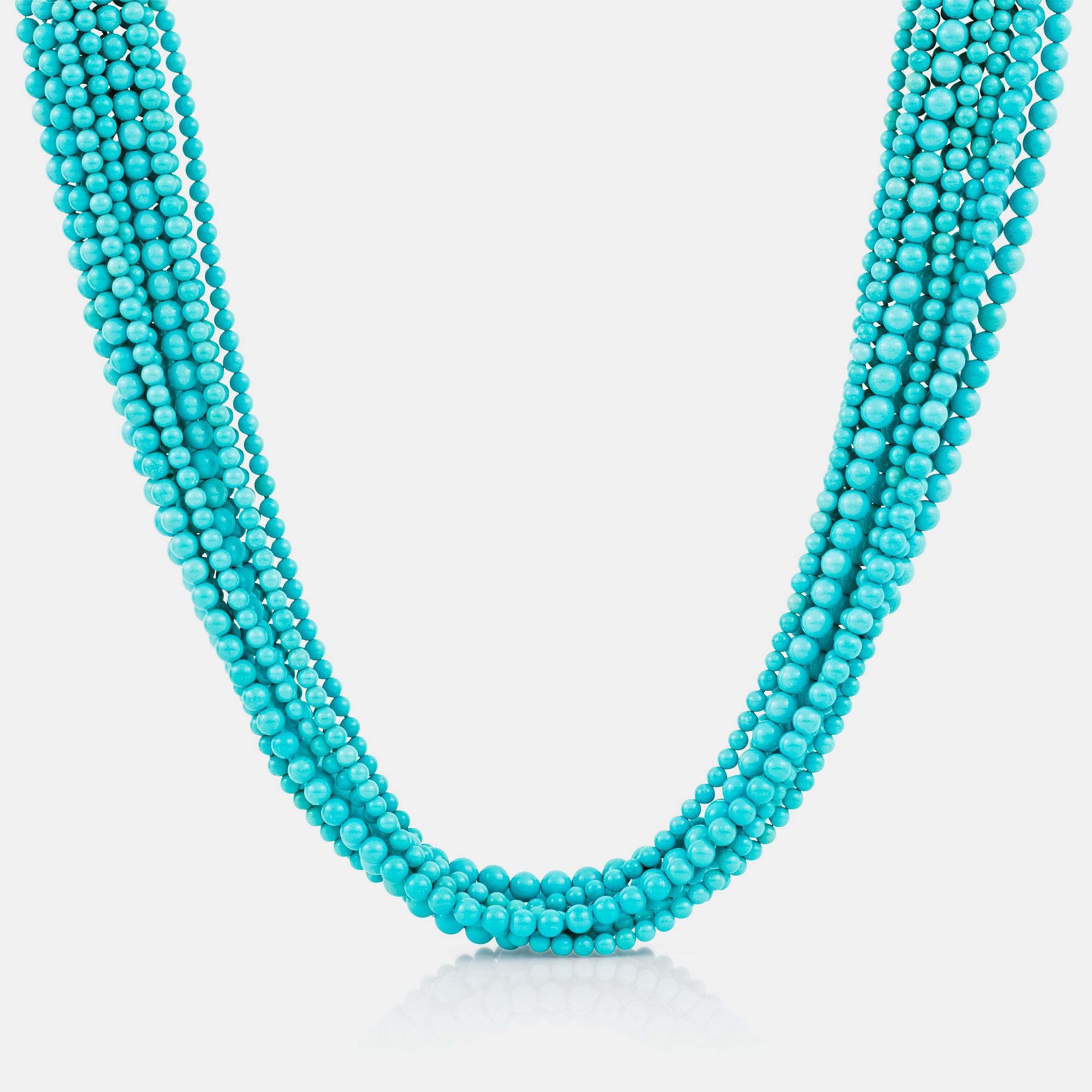 A 12-strand turquoise and wood necklace signed Trianon.