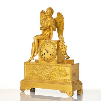 A figural Empire ormolu mantel clock, Paris, early 19th century.