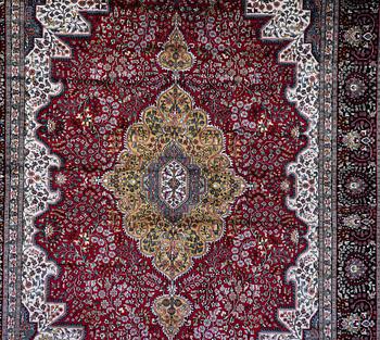 A carpet, Oriental Silk, ca 337 x 241 cm.
