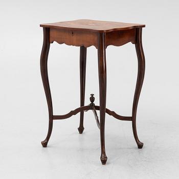 A Rococo style rosewood-veneered and mahogany sewing table, early 20th century.