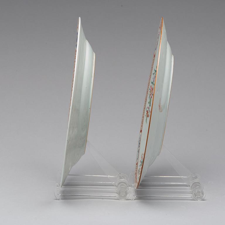 A pair of famille rose 'double peacock' dishes, Qing dynasty, Qianlong (1736-95).
