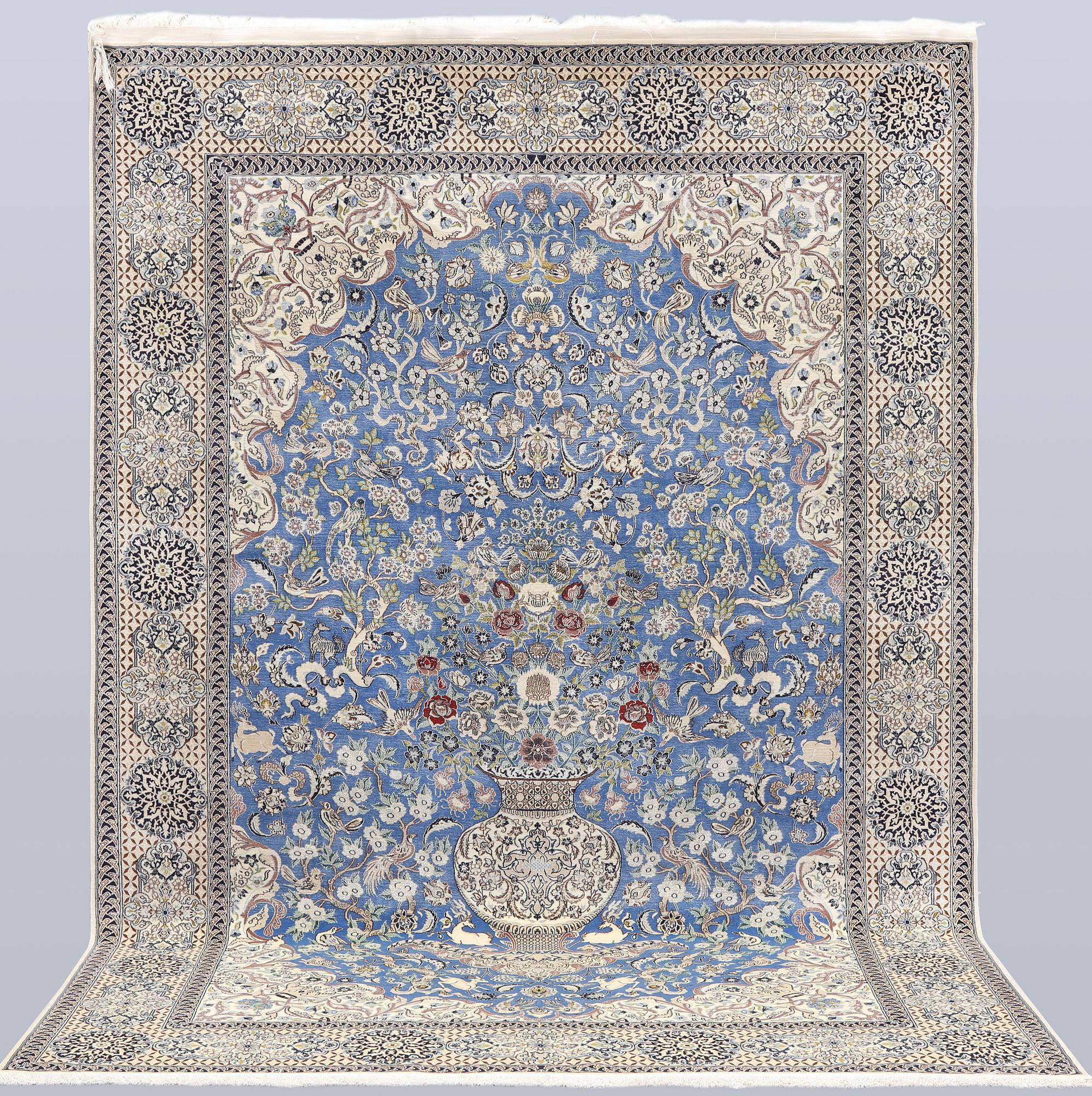 A Figural Nain-Isfahan carpet, part silk, 318 x 213 cm.