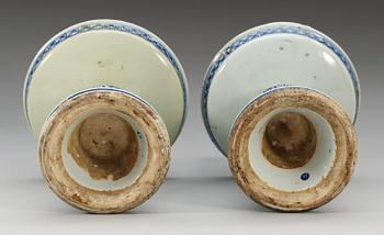 A pair of blue and white candlesticks, Qing dynasty, 18th Century. (2).