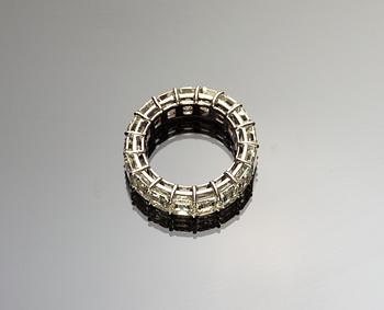 An emerald cut diamond eternity ring, tot. 12.60 cts.