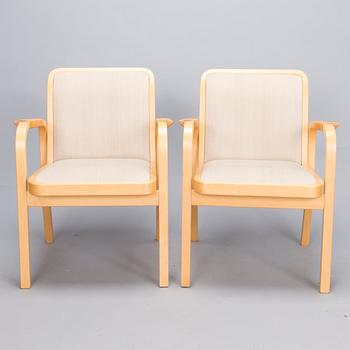ALVAR AALTO, Pair of model 'E45' armchairs for Artek, late 20th Century.
