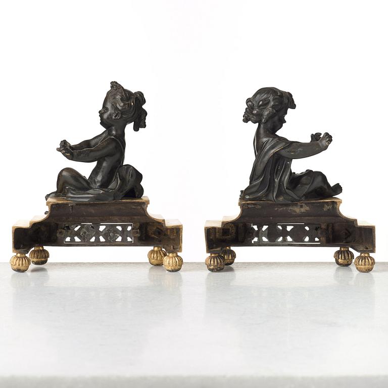 A pair of Louis XVI late 18th century fire dogs.