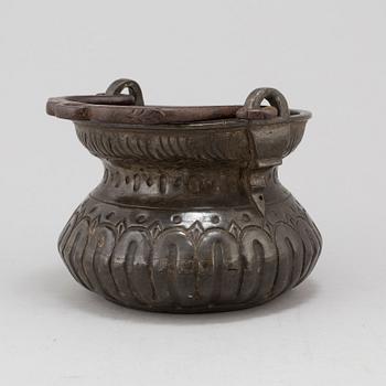 A holy water bowl dated 1620.