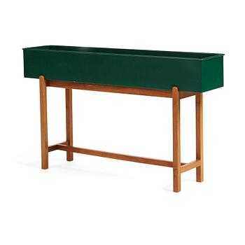 297. Josef Frank, a walnut and green lacquered tin flower stand, Svenskt Tenn, Sweden 1950-1960s, model no 2205.