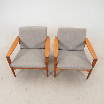 A pair of teak easy chairs, Denmark middle fo the 20th century.