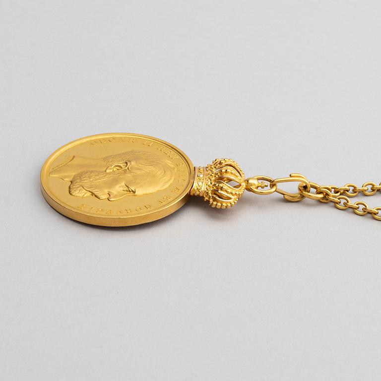 The Royal Illis Quorum medal in gold with chain awarded to Ludvig Berckhan Falkman.