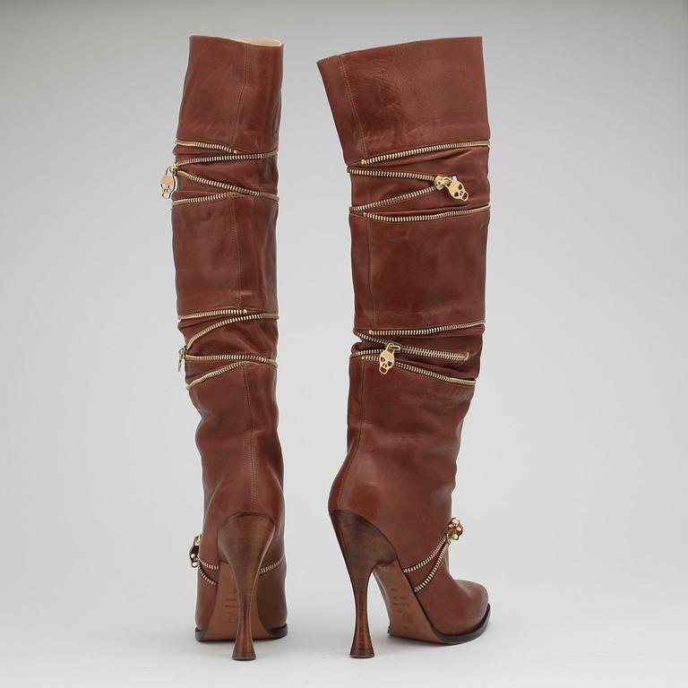 ALEXANDER MCQUEEN, a pair of brown leather boots.