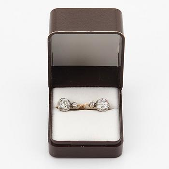 A pair of 14K gold earrings set with old-cut diamonds with a total weight of ca 2.50 cts.