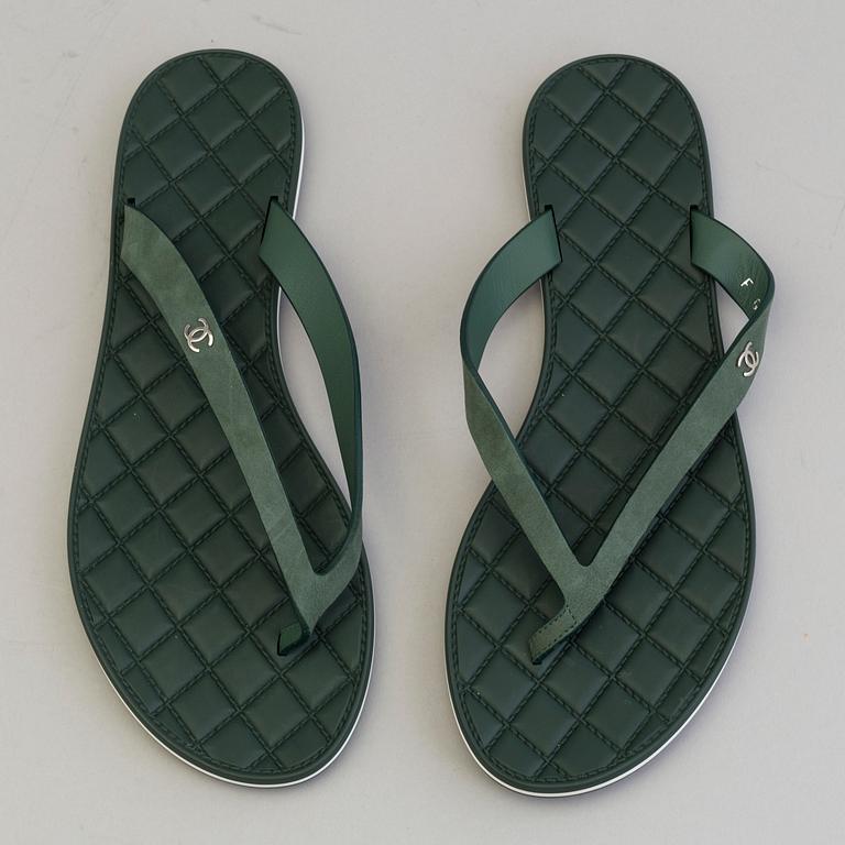 CHANEL, a pair of plastic flip-flop sandals, size 37.