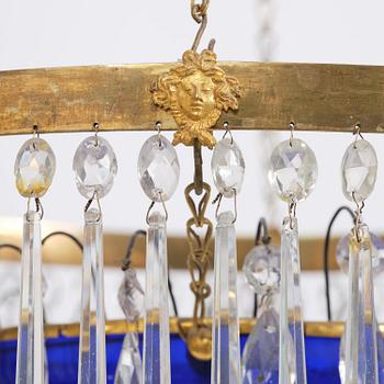 A late Gustavian five-light gilt brass and cut glass chandelier, Stockholm, late 18th century.