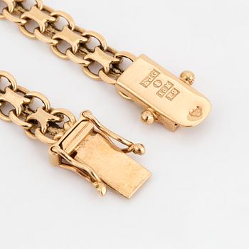 A charm bracelet, 18K gold.