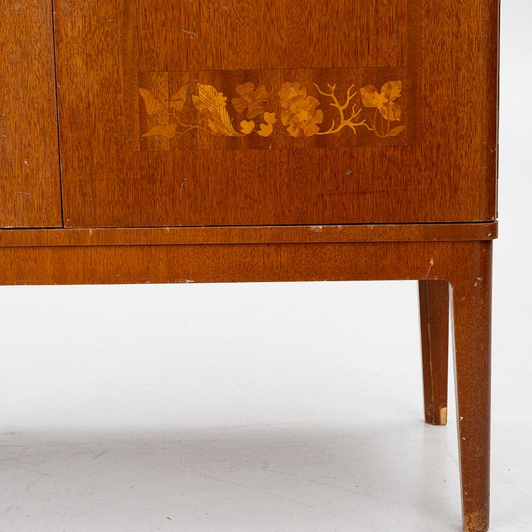 A Swedish Modern cabinet, 1940s.