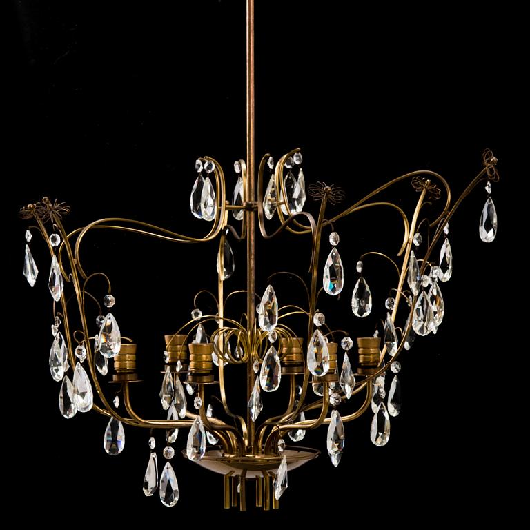 PAAVO TYNELL, A mid 20th Century brass chandelier for Oy Taito Ab.