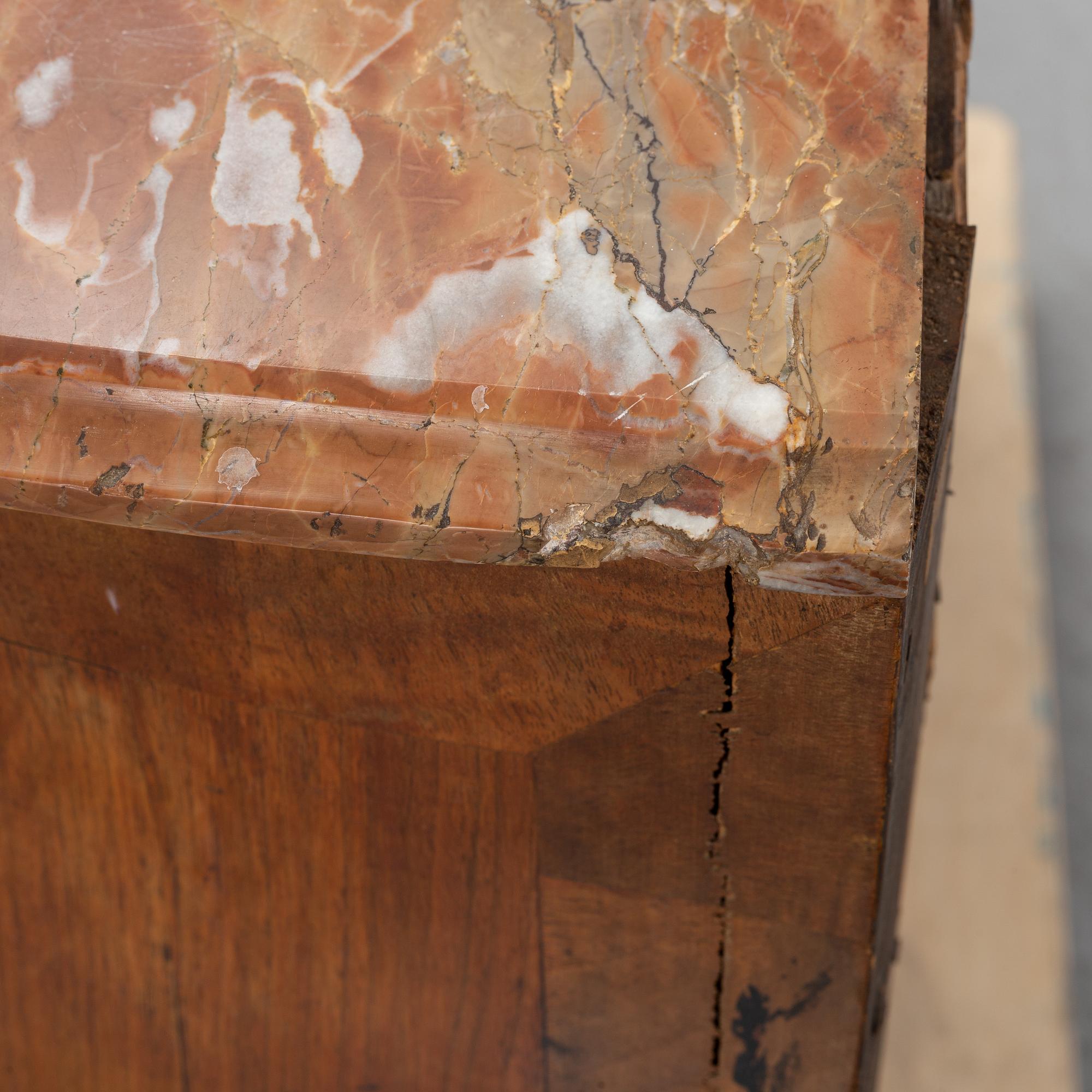 A 19th Century rococo style chest of drawers.