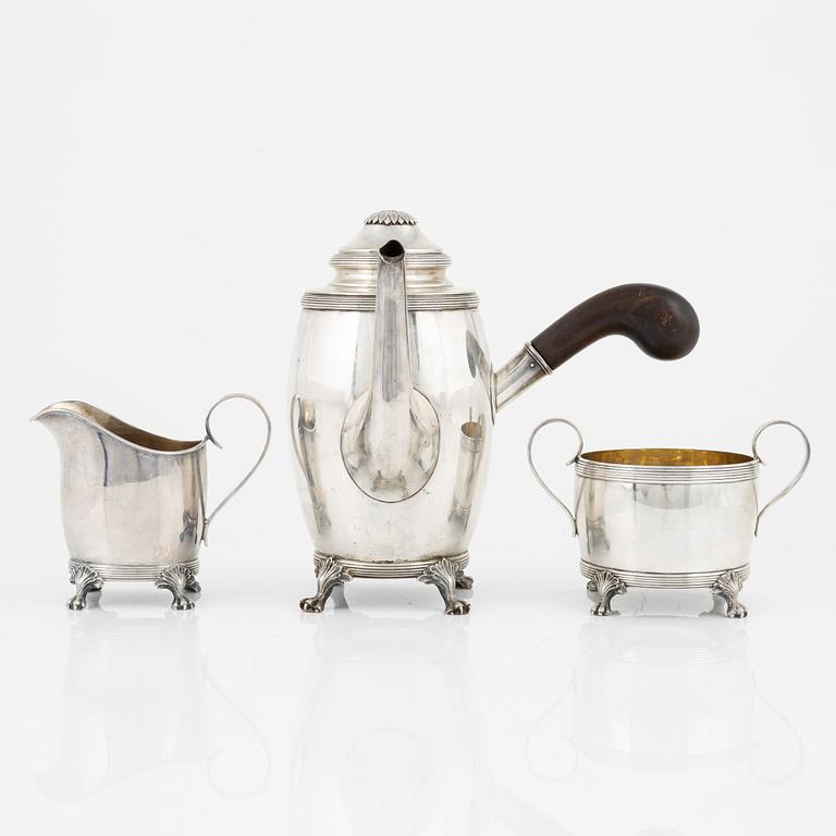 A Swedish Silver Coffee Pot, Creamer and Sugar Bowl, mark of CG Hallberg, Stockholm 1917-18.