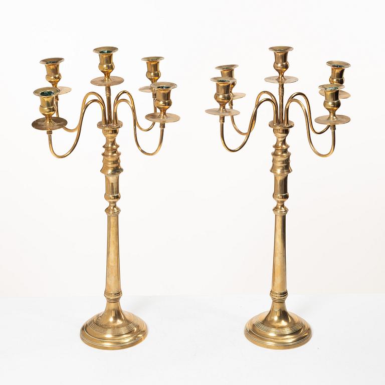 A pair of brass candelabra, model N12, Nyköpings Bruk, Sweden, around 1900.
