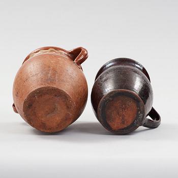 two earthenware pots from the 19th century.