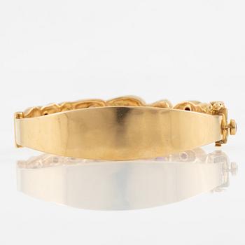 Bracelet, Robbert, 18K gold with red stones. Trosa 1971.