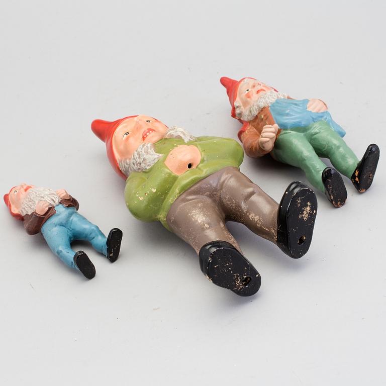 Three painted terracotta santa claus figurines from the first half of the 20th century.