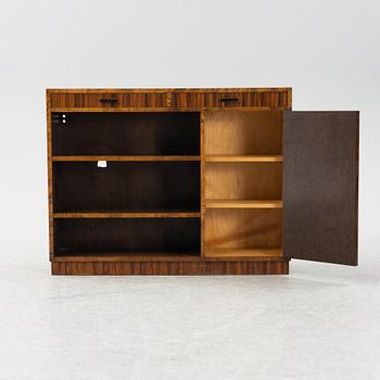 A stained birch veneered bookcase with cabinet, 1930's.