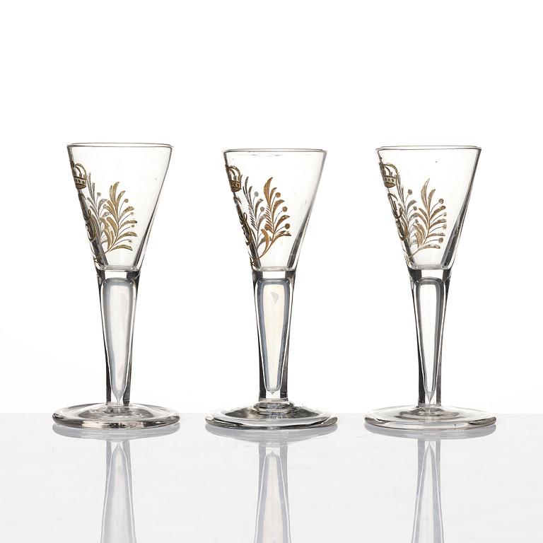 A set of six glasses and a bottle, Sweden, 18th century with King Gustavus IIIs monogram.