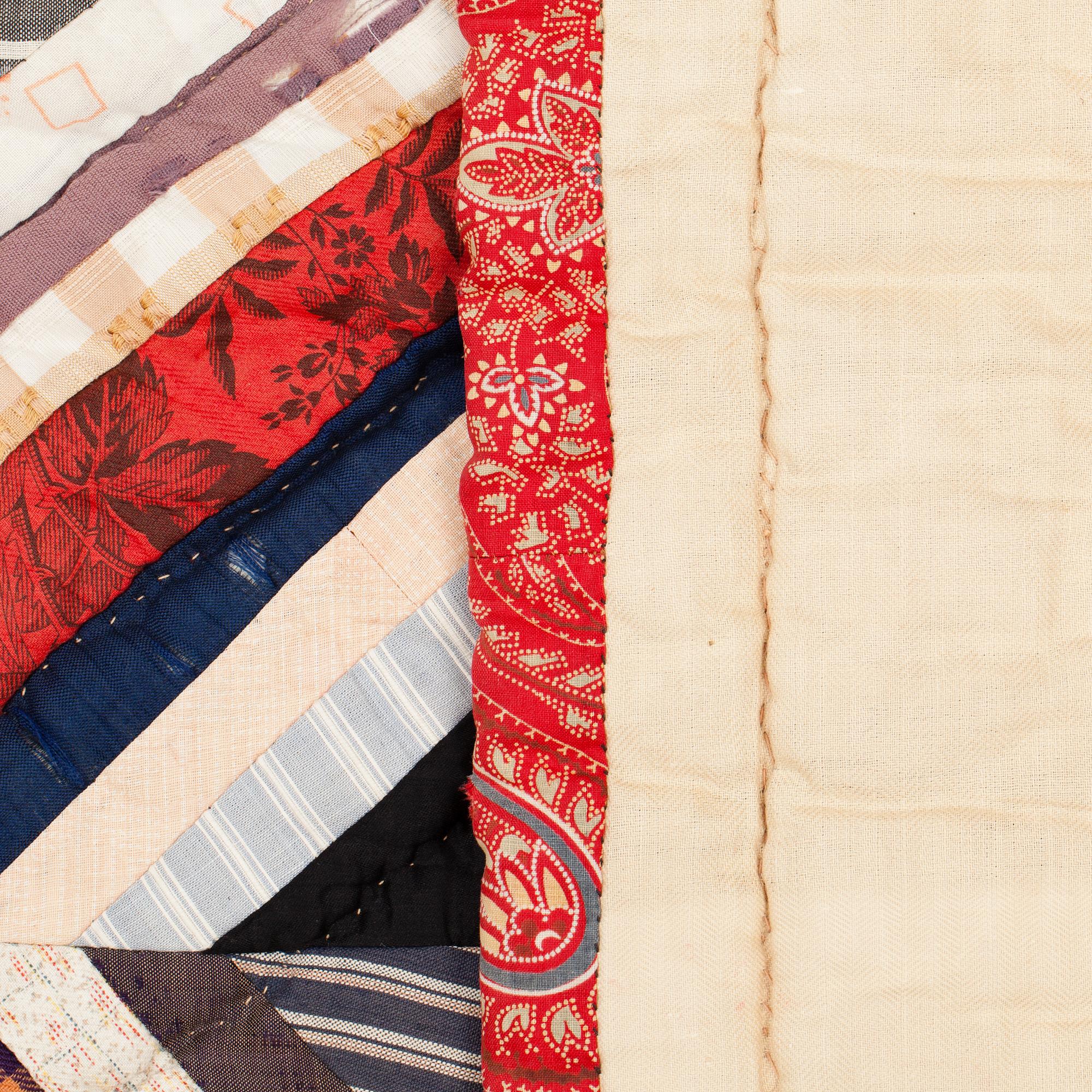 A QUILTED PATCHWORK BED COVER, Sweden first half of the 20th century, ca 191 x 139 cm.