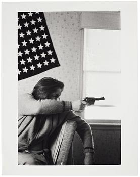 Larry Clark, "Untitled (man, flag, gun)", 1971.