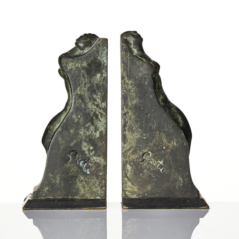 Axel Gute, a pair of Swedish Grace patinated bronze bookends, 1920s.