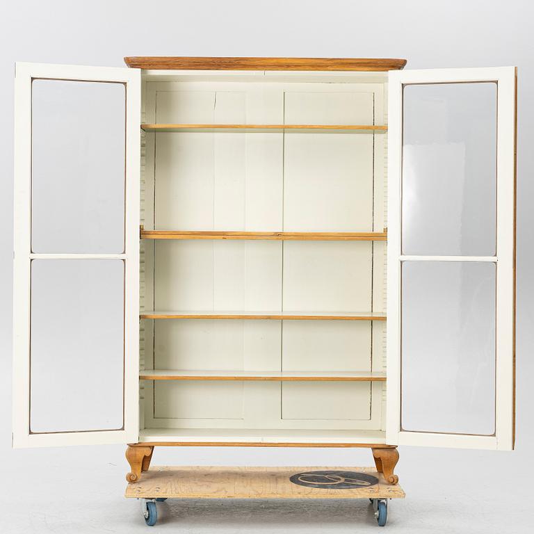 Display cabinet, circa 1900.