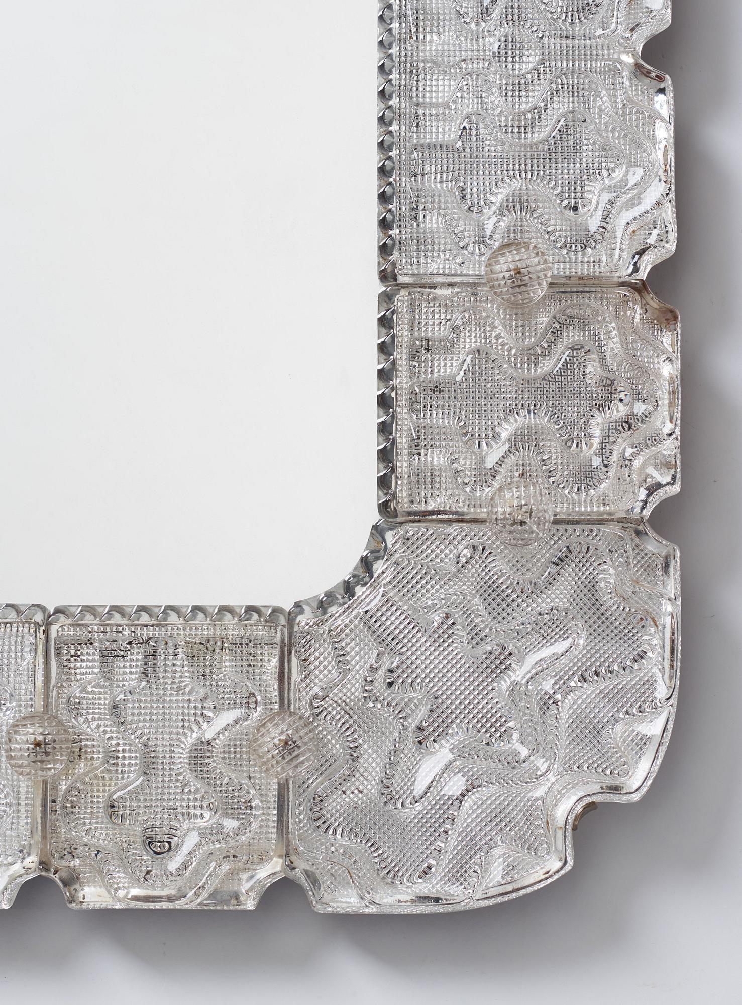 Carl Fagerlund, a Swedish Modern cast glass framed mirror, Orrefors ca 1940-50's.