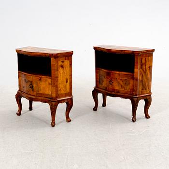 A pair of walnut veneered bedside tables from the second half ot the 20th century.