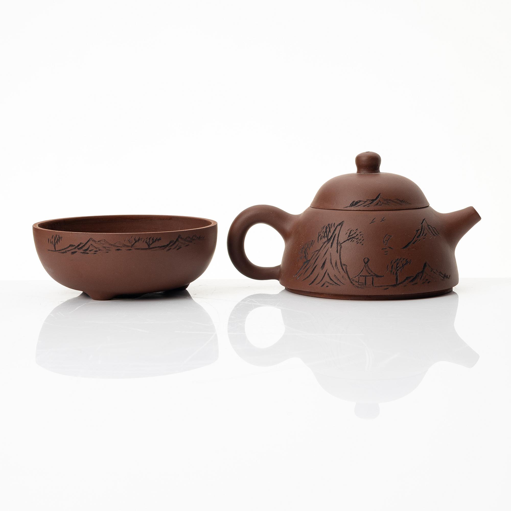 Wu Quan Xiang, A Chinese yixing teapot and a bowl with sieve and four cups, 1980s.