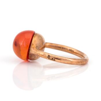 A 'Rouge Passion' ring by Pomellato set with a cabochon-cut, synthetic, orange sapphire.