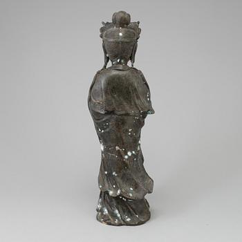 A standing figure of a Buddha.