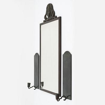 A mirror and a pair of bronze sconces, Swedish Grace, Ystad Brons, 1920-/30s, including Oscar Antonsson.