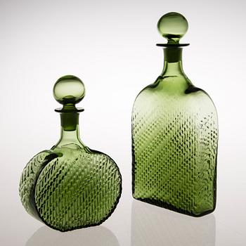 Two 'Flindari' glass carafes with stoppers from Riihimäen Lasi, in production 1964-68.