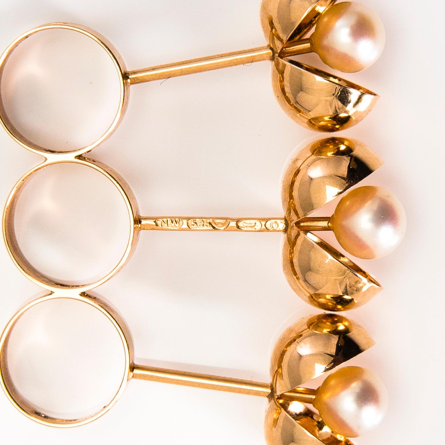 A set of 14K gold pendant and earrings with pearls by Olli Auvinen. Westerback Eino Ky, Helsinki 1967.