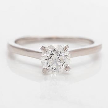 A 14K gold ring with brilliant-cut diamond.