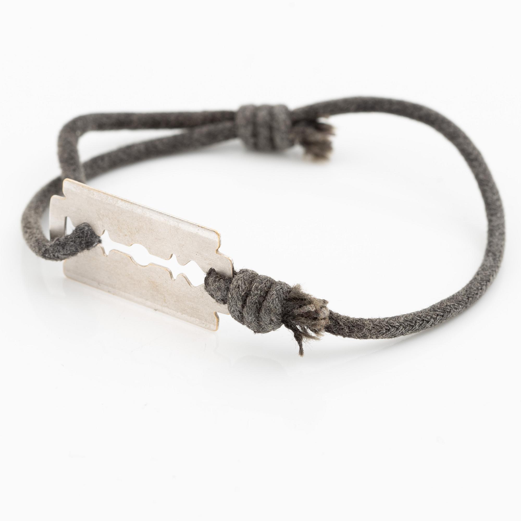 Bracelet, Dinh Van, textile and 18K white gold.