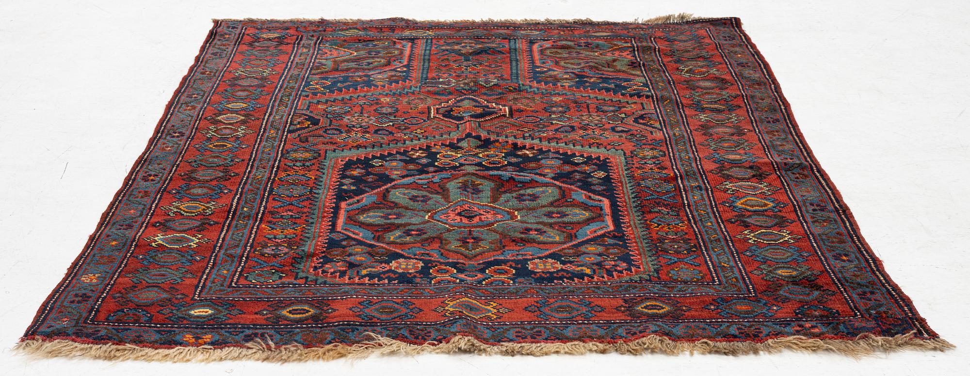 An antique Northwest Persian rug, c. 179 x 143 cm.